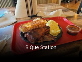 B Que Station